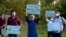 Members of a civil society group hold a demonstration demanding the government allow the construction of a Hindu temple, in Islamabad, Pakistan, July 8, 2020. 