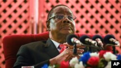 FILE - Former Malawi President Peter Mutharika addresses the media at a news conference in Blantyre, June 27, 2020.
