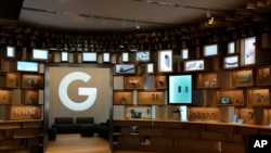 FILE - Items are displayed in the Google Store in Mountain View, Calif., Oct. 11, 2023. The Justice Department says a former software engineer at Google has been charged with stealing artificial intelligence technology while secretly working with two companies based in China. 