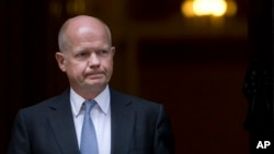 Britain's Foreign Secretary William Hague leaves 10 Downing street following a national security meeting at Downing Street in London, Aug. 28, 2013. 