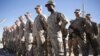 FILE - US Marines watch during a change of command ceremony at Task Force Southwest military field, Helmand province, Afghanistan, Jan. 15, 2018.