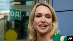 FILE - Marina Ovsyannikova, a former Russian state TV journalist who quit after making an on-air protest of Russia's invasion of Ukraine, speaks to journalists in Moscow, Russia, on July 28, 2022. Ovsyannikova, now living in exile in France, is being tried in absentia in Russia.