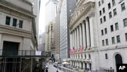 FILE - The New York Stock Exchange is pictured, Nov. 23, 2020. U.S. stocks finished higher on Jan. 8, 2021, despite a sober reminder of how many jobs the pandemic has eliminated. 