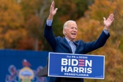 Democratic presidential candidate former Vice President Joe Biden speaks at a drive-in campaign stop at Bucks County Community College in Bristol, Pa., Oct. 24, 2020.