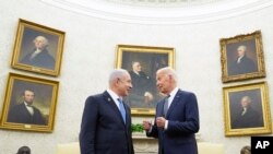 FILE - President Joe Biden, right, talks with Israeli Prime Minister Benjamin Netanyahu in the Oval Office of the White House in Washington, July 25, 2024.