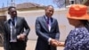 Botswana opposition leader Duma Boko shakes hands with a woman after his party UDC won the general election, outside his home in Gaborone, Botswana, Nov. 1, 2024