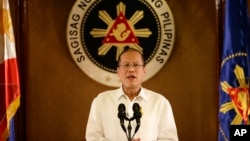 FILE - Philippine President Benigno Aquino III addresses the nation in a live broadcast from the Presidential Palace in Manila.