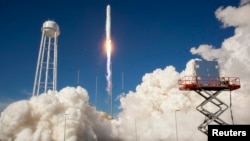 FILE - The Orbital Sciences Corporation Antares rocket is seen as it launches from Pad-0A of the Mid-Atlantic Regional Spaceport (MARS) at the NASA Wallops Flight Facility in Virginia, April 21, 2013. 