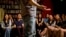In this May 24, 2015 photo, audience laugh as a standup comedian performs during a comedy show at a bookstore in Beijing. Western-style standup comedy is a small yet growing scene in China that reflects wider changes toward more cultural freedom. (AP/Mark Schiefelbein)