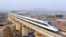 FILE - A high-speed train travelling to Guangzhou is seen running on Yongdinghe Bridge in Beijing, December 26, 2012. 