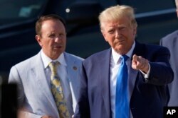 FILE - Former President Donald Trump arrives at New Orleans International Airport on July 25, 2023, accompanied by then-Louisiana Attorney General Jeff Landry. Nearly 60% of Louisiana voters chose Trump in the 2020 presidential election.