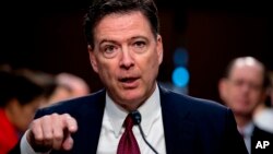 FILE - Former FBI director James Comey speaks during a Senate Intelligence Committee hearing on Capitol Hill, in Washington, June 8, 2017. 