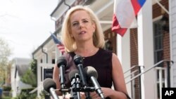 FILE - Then-Homeland Security Secretary Kirstjen Nielsen talks outside her home in Alexandria, Va., on April 8, 2019.