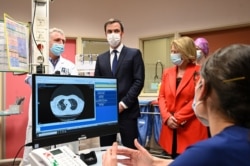 French Health Minister Olivier Veran and French Junior Minister of Autonomy Brigitte Bourguignon visit the coronavirus disease emergency and intensive care units of the Hospital Centre in Dunkirk, Feb. 24, 2021.