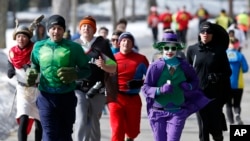 Runners in costume train for the Boston Marathon in Newton, Mass., March 1, 2014.