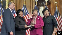 Rep. Eddie Bernice Johnson, D-Texas, second from right, participates in a ceremonial swearing in with House Speaker John Boehner of Ohio, on Capitol Hill in Washington, January 5, 2011 (file photo)
