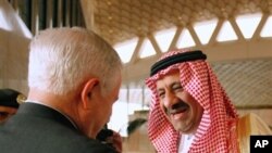 U.S. Defense Secretary Robert Gates, left, is greeted by Saudi Assistant Minister of Defense and Aviation Prince Khalid bin Sultan, on Gates' arrival in Riyadh, Saudi Arabia, April 6, 2011