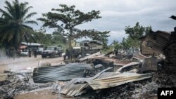 FILE - Burned houses are seen near Beni, Democratic Republic of the Congo, Feb. 18, 2020, after an attack allegedly perpetrated by Allied Democratic Forces. Officials said March 9, 2023, that the group is suspected of another attack killing at least 36 civilians.