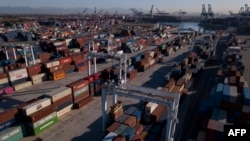 FILE - An aerial image shows cargo shipping containers at the Port of Los Angeles in San Pedro, California, Oct. 15, 2021.