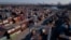 FILE - An aerial image shows cargo shipping containers at the Port of Los Angeles in San Pedro, California, Oct. 15, 2021.