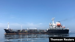 FILE - An oil tanker is seen in the sea outside the Puerto La Cruz oil refinery in Puerto La Cruz, Venezuela, July 19, 2018.