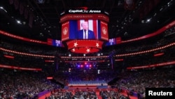U.S President Donald Trump is shown on a screen on the Inauguration Day of his second presidential term, inside Capital One Arena in Washington on Jan. 20, 2025.