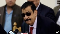 Egyptian Judge Mohammed Nagi Shehata arrives to a courtroom to read the verdicts in a case rooted in violence that swept the country after the military-led ouster of Islamist President Mohamed Morsi in 2013, in Cairo, April 11, 2015. 