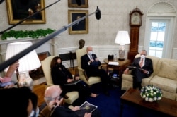President Joe Biden and Vice President Kamala Harris meet with Senate Majority Leader Chuck Schumer (D-NY) and Democratic senators to discuss efforts to pass coronavirus relief legislation in the Oval Office at the White House, Feb. 3, 2021.