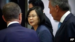 Taiwan President Tsai Ing-we, center, leaves after participating in the U.S. Taiwan Business Summit, Friday July 12, 2019, in New York.