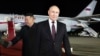 FILE - Russian President Vladimir Putin, right, walks as North Korea's leader Kim Jong Un shakes hands with the Russian delegation during their meeting at the Pyongyang Sunan International Airport outside Pyongyang, North Korea, early Wednesday, June 19, 2024.