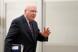 FILE - Democratic Senator Patrick Leahy waves as he arrives at the Capitol in Washington, Jan. 30, 2020.