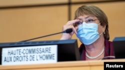 United Nations' High Commissioner for Human Rights Michelle Bachelet adjusts her glasses during the opening of 45th session of the Human Rights Council, at the European U.N. headquarters in Geneva, Switzerland, Sept. 14, 2020.