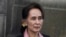 FILE - Myanmar's Aung San Suu Kyi leaves the International Criminal Court after the first of three days of hearings in The Hague, the Netherlands, Dec. 10, 2019. 