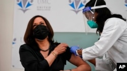 Vice President-elect Kamala Harris receives the Moderna COVID-19 vaccine from nurse Patricia Cummings, at United Medical Center in southeast Washington, Dec. 29, 2020.