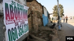 In South African townships, there are plenty of advertisements offering illegal abortions, but little education about HIV. (D. Taylor/VOA)