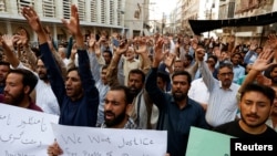 FILE - Pakistani Shiite Muslims condemn killings of people by gunmen in the Kurram tribal district of Khyber Pakhtunkhwa province, during a protest in Karachi, Pakistan, Nov. 22, 2024. Shiite and Sunni tribes in the area reached a peace deal Jan. 1, 2025.