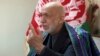 FILE - Former Afghan President Hamid Karzai speaks in Kabul, Afghanistan, April 17, 2017. 