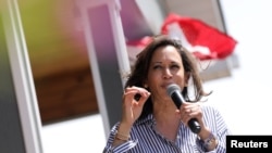 FILE - Democratic presidential hopeful U.S. Senator for California Kamala Harris speaks to the press.