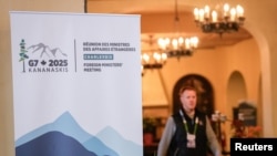 A man walks near the meeting room at the Manoir Richelieu before the G7 Foreign Ministers summit in La Malbaie, Quebec, Canada, March 12, 2025. 