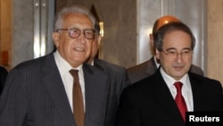 Pope Francis makes a blessing as he delivers his first "Urbi et Orbi" (to the city and world) message from the balcony overlooking St. Peter's Square at the Vatican, Dec. 25, 2013