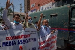 Kashmiri journalists shout slogans during a protest against a new media policy that was announced last month in Srinagar, Kashmir, July 6, 2020.