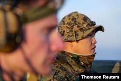 FILE - Members of South Korean and U.S. special forces take part in a joint military exercise at Gunsan Air Force base in Gunsan, South Korea, March 14, 2016.