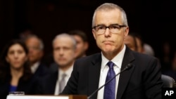 FILE - Then-acting FBI Director Andrew McCabe listens on Capitol Hill in Washington, May 11, 2017, while testifying before a Senate Intelligence Committee hearing on major threats facing the U.S. 