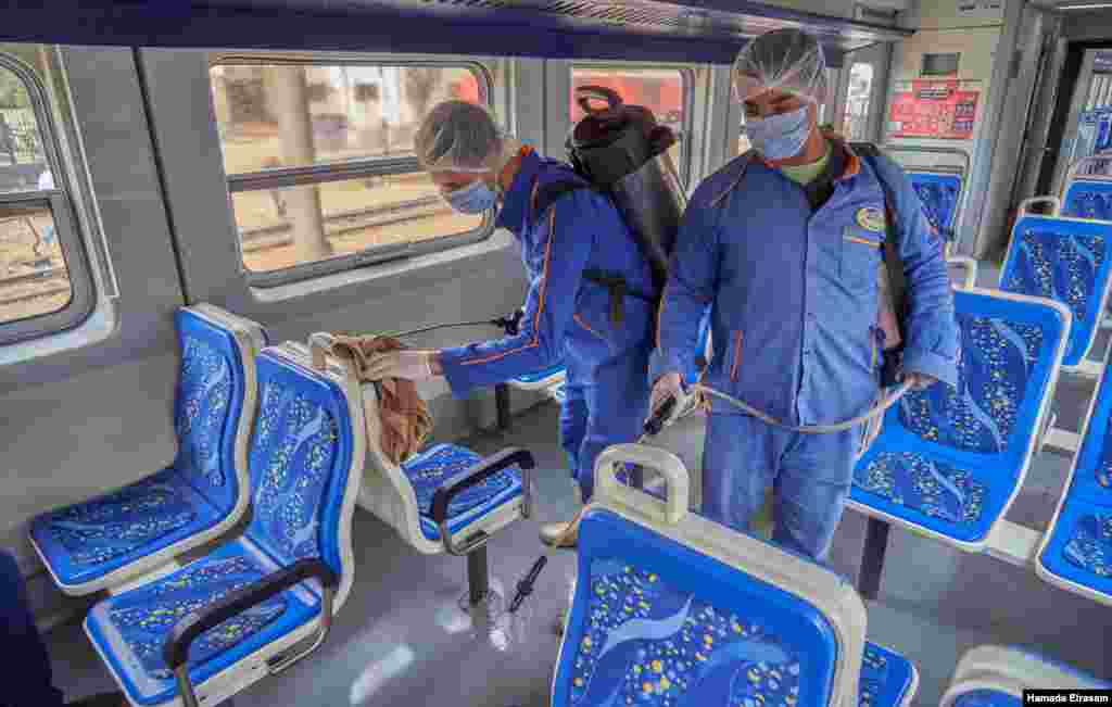 Workers clean trains at Cairo's main station on March 24, 2020. (VOA/H. Elrasam)