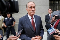 U.S. Rep. Chris Collins, R-N.Y., speaks to reporters as he leaves the courthouse after a pretrial hearing in his insider-trading case, in New York, Sept. 12, 2019.