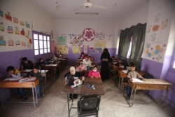 Many children who do attend school in Idlib, Syria, arrive late or leave early because they have to work. Dec. 1, 2020. (VOA)