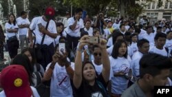 Demonstrators rally in Yangon on Jan. 22, 2017, to denounce the country's controversial sweeping telecommunications law.