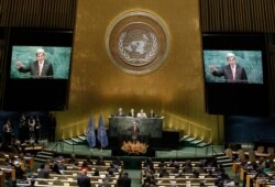 FILE - Then-U.S. Secretary of State John Kerry addresses delegates at a special "High-Level Event on Entry into Force of the Paris Agreement on Climate Change" meeting held at U.N. headquarters in New York, Sept. 21, 2016.