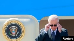 U.S. President Joe Biden steps off Air Force One at Cointrin airport as he arrives ahead of a meeting with Russian counterpart Vladimir Putin in Geneva, Switzerland, June 15, 2021. 