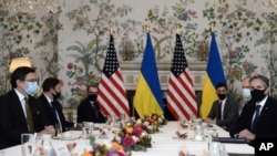 Ukrainian Foreign Minister Dmytro Kuleba, left, meets with United States Secretary of State Antony Blinken, right, in Brussels, Belgium, April 13, 2021.